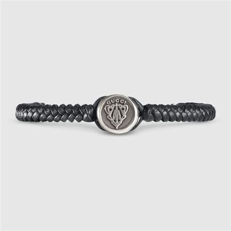 Woven leather bracelet with Gucci crest tag